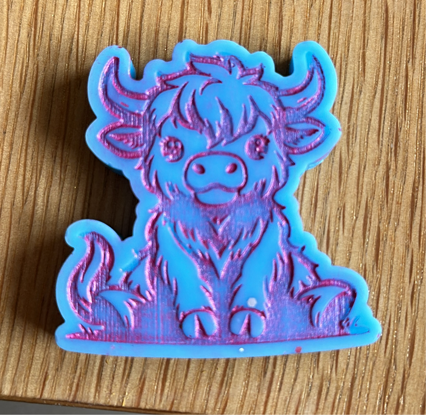 Sitting Highland Cow